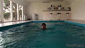 two redhead lesbians fist each other in public pool