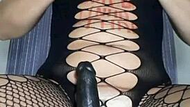 Mireladelicia strips in black fishnets, uses dildo and anal plug