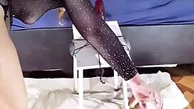 Exhibitionist rides massive red dildo with skill