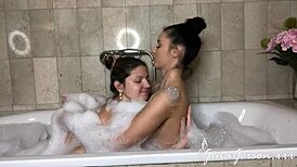 Nelly Kent and Gina Gerson share a steamy lesbian fuck in the bathroom