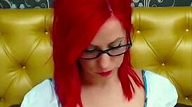 Charming redhead sips a glass of pepper with a smile. 😊