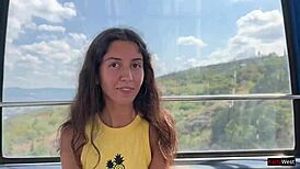 Beautiful girl gives a close up blowjob on a Ferris wheel in an amusement park