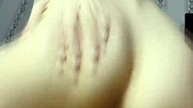 Ki-sim casually rides a huge cock in cowgirl style on the bed.