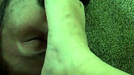 Sweaty barefoot foot worship session with slave elements.
