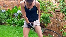 This skinny little girl pisses in the garden. Then she twerks her tiny ass for fun