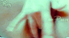 She fingers her shaved pussy closeup