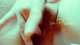 She fingers her shaved pussy closeup