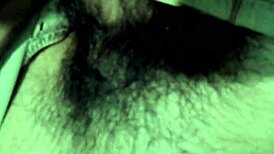 Shemale with big cock gets cumshot while sounding, hairy details unfold in the scene