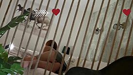 Petite redhead strips down, changes outfits, then teases a soft cock on bed.