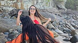 Two hot latinas suck big cock on beach!