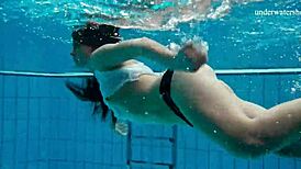 horny teen 18+ strips fast in pool showing tight pussy underwater