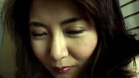 Hot japanese brunette gives natural tits handjob closeup 😍