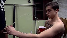 Bryce Corbin blindfolded in a masked orgy gathering with others