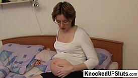 Pregnant brunette in glasses toys her pussy and ass