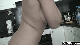 horny babe gropes herself in the kitchen