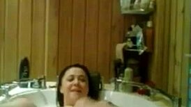 Relaxing under the hot water in the shower