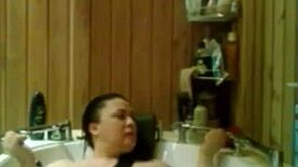 Relaxing under the hot water in the shower