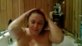 Relaxing under the hot water in the shower