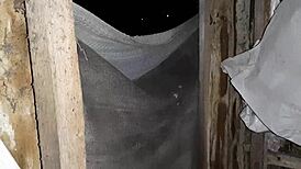 Girls hide from rain in abandoned spot for talk