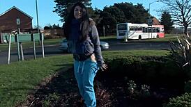 Naughty and horny strips and pisses in the middle of the street in front.