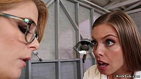 lesbian in red lingerie fiercely anal fucks babe with strapon, dominating with fisting in wild bondage scene.