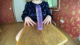 This hot milf with a very big ass in oil just jumps on a dildo.