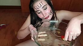 Amateur slut degrades herself by eating fruits with urine on them and writes dirty messages on her body