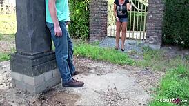 German mom catches stepson jerking in garden and joins him.