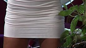 Bombshell Teases with Face Strapon for Solo Fun