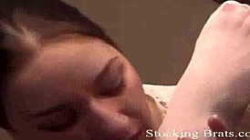 Watch her slowly slide on her stockings in this femdom scene