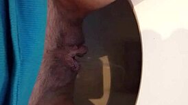 Greta goes to the bathroom and then warms up under the blanket