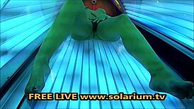 horny milf with big breasts masturbates in solarium.