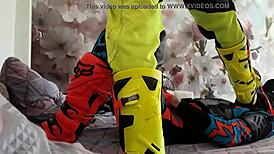 Gay biker treads boots in motocross costume fun