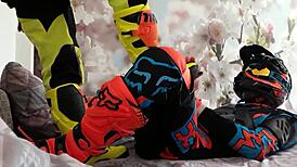 Gay biker treads boots in motocross costume fun