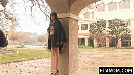 Busty milf sips coffee while flashing assets on public street