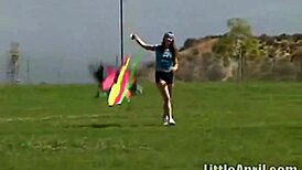 Teen Little April rubs her clit outdoors while sucking a popsicle. She’s all alone showing off.