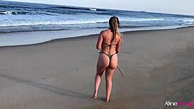 Blonde girl gets wild on the beach banging her fan