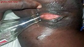 I'm playin with this ebony pussy and fuckin it with a coke cola bottle