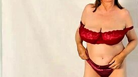 hot granny flaunts huge natural tits while stripping down. closeup reveals tight asshole and wet pussy!