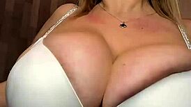 Dancing on the bed with big natural tits