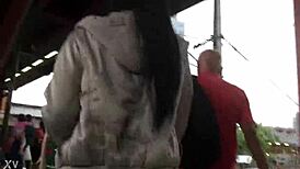 Jacket and boots candidly exposed on the train street scene.