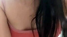 Amateur video with a young woman in an intimate setting.