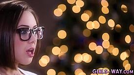 Girls in stockings enjoy scissoring during christmas celebration