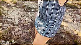 The wife accidentally forgets her panties and flashes her shaved pussy during an upskirt moment in the skirt.