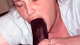 going wild sucking this beautiful big black cock in the bedroom.