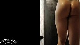 the redhead cowgirl shaves her pussy in the shower, making it smooth and wet