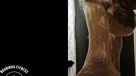 the redhead cowgirl shaves her pussy in the shower, making it smooth and wet