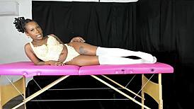 Modeling lace vintage lingerie, she shows off big ebony curves. Retro vibes shine.