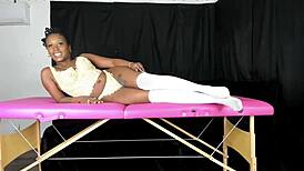 Modeling lace vintage lingerie, she shows off big ebony curves. Retro vibes shine.