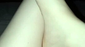 a slut shows her bare feet in the dark